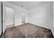 Bedroom with neutral walls, plush carpet, and an open doorway to the en suite bathroom at 13855 Sharp Hawk Dr, Riverview, FL 33569