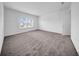 Large bedroom featuring neutral carpet and two bright windows at 13855 Sharp Hawk Dr, Riverview, FL 33569