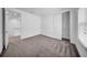 This is a spacious bedroom with wall to wall carpet and a closet at 13855 Sharp Hawk Dr, Riverview, FL 33569