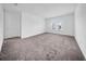 Spacious bedroom with plush carpeting, bright windows, and a neutral color palette providing a serene atmosphere at 13855 Sharp Hawk Dr, Riverview, FL 33569