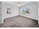 This is a spacious bedroom with wall to wall carpet and two windows at 13855 Sharp Hawk Dr, Riverview, FL 33569