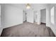 Neutral bedroom with plush carpet, recessed lighting, and doors to the closet and bathroom at 13855 Sharp Hawk Dr, Riverview, FL 33569