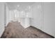 Bright hallway with neutral walls, plush carpet, and white doors for an airy feel at 13855 Sharp Hawk Dr, Riverview, FL 33569