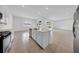 Modern kitchen features a central island, stainless steel appliances, and plenty of counter space at 13855 Sharp Hawk Dr, Riverview, FL 33569
