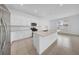 Well-equipped kitchen with white cabinets, stainless appliances, and a center island with sink at 13855 Sharp Hawk Dr, Riverview, FL 33569