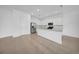 Modern kitchen with white cabinets, stainless steel appliances, and a center island at 13855 Sharp Hawk Dr, Riverview, FL 33569