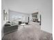 Large living area with comfortable seating, modern entertainment center, and plenty of natural light at 13855 Sharp Hawk Dr, Riverview, FL 33569