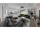 Spacious living area with a modern chandelier, stylish decor, and sliding glass doors to backyard at 13855 Sharp Hawk Dr, Riverview, FL 33569