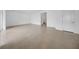 Open-concept living room showcases tile floors, white walls, and a bright, airy atmosphere at 13855 Sharp Hawk Dr, Riverview, FL 33569