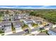 Charming homes line a street in a Gathering-friendly neighborhood, showcasing manicured lawns and inviting curb appeal at 13855 Sharp Hawk Dr, Riverview, FL 33569
