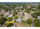 Aerial view of the home highlighting the backyard pool and lush landscaping at 1398 Lemon St, Clearwater, FL 33756
