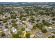 Wide aerial view of the neighborhood, showcasing a single-Gathering home with a pool at 1398 Lemon St, Clearwater, FL 33756