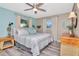 Cozy bedroom featuring soft colors, two windows, and tasteful decor for a calming retreat at 1398 Lemon St, Clearwater, FL 33756