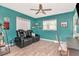 Cozy den with a ceiling fan, an office area and comfortable seating, perfect for relaxing at 1398 Lemon St, Clearwater, FL 33756