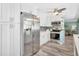 Modern kitchen with stainless steel appliances and abundant cabinetry for storage and food preparation at 1398 Lemon St, Clearwater, FL 33756