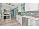 Updated kitchen featuring stainless steel appliances, quartz countertops, and coastal-inspired backsplash at 1398 Lemon St, Clearwater, FL 33756