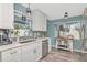The modern kitchen features stainless appliances, and a stylish backsplash adds a touch of elegance at 1398 Lemon St, Clearwater, FL 33756