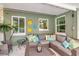 Comfortable patio seating with a neutral colors creates a relaxing outdoor living space at 1398 Lemon St, Clearwater, FL 33756