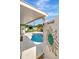 Outdoor area featuring a private pool, tiki bar, white privacy fence and artistic decor at 1398 Lemon St, Clearwater, FL 33756