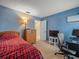 Cozy bedroom with blue walls, carpet, and a TV for relaxing at 16015 Glen Haven Dr, Tampa, FL 33618