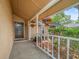 Inviting front porch with hanging flower baskets and decorative landscaping creating a welcoming entrance at 16015 Glen Haven Dr, Tampa, FL 33618
