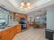 Bright eat-in kitchen with traditional cabinetry and stainless steel appliances at 16015 Glen Haven Dr, Tampa, FL 33618