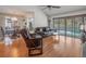 Open-concept living room with a view of the pool area and a dining space at 16015 Glen Haven Dr, Tampa, FL 33618
