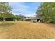 Expansive backyard featuring a home, screened in patio, two gazebos, and plenty of green space at 1609 S Valrico Rd, Valrico, FL 33594