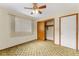Well-lit bedroom with a ceiling fan and closet providing ample space at 1609 S Valrico Rd, Valrico, FL 33594