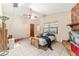 Bedroom featuring a stone fireplace, ceiling fan, and tile flooring at 1609 S Valrico Rd, Valrico, FL 33594