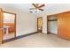 Bedroom with vinyl flooring, a closet, and a bathroom at 1609 S Valrico Rd, Valrico, FL 33594