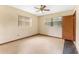 Bright bedroom with multiple windows and vinyl flooring, ideal for natural light at 1609 S Valrico Rd, Valrico, FL 33594
