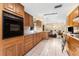 Kitchen featuring classic wood cabinets and tile flooring at 1609 S Valrico Rd, Valrico, FL 33594
