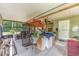 Cozy screened patio with outdoor furniture and views of the surrounding outdoor space at 1609 S Valrico Rd, Valrico, FL 33594