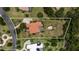 An aerial view of the property showcasing backyard, pool and proximity to other homes at 16124 Suncrest Shores Dr, Odessa, FL 33556