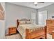 Comfortable bedroom with a ceiling fan, large window, and spacious closet at 16124 Suncrest Shores Dr, Odessa, FL 33556