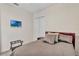 Cozy bedroom with a comfortable bed, TV, and closet for storage at 16124 Suncrest Shores Dr, Odessa, FL 33556