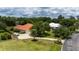 Side exterior shot of home with an attached garage, driveway, manicured lawn, and fenced yard at 16124 Suncrest Shores Dr, Odessa, FL 33556