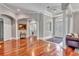 Spacious entrance foyer boasting natural light, hardwood floors, white columns, and ample living space at 16124 Suncrest Shores Dr, Odessa, FL 33556