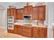 Well-equipped kitchen featuring stainless steel appliances, custom cabinets, and sleek countertops at 16124 Suncrest Shores Dr, Odessa, FL 33556