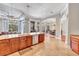 Bright, open concept kitchen with granite countertops, wood cabinets, and stainless steel appliances at 16124 Suncrest Shores Dr, Odessa, FL 33556