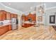Spacious kitchen with granite countertops, stainless steel appliances, and custom cabinetry at 16124 Suncrest Shores Dr, Odessa, FL 33556
