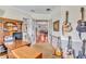 Home office featuring a desk, guitars, and a view into the open-concept home at 16124 Suncrest Shores Dr, Odessa, FL 33556