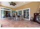 Outdoor kitchen with grill and bar area, perfect for entertaining by the fireplace at 16124 Suncrest Shores Dr, Odessa, FL 33556