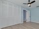 Bedroom with hardwood floors, large closet, and ceiling fan at 1624 Chateau Dr, Clearwater, FL 33756