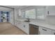 Modern kitchen featuring stainless steel appliances, sleek countertops and ample cabinet space at 1624 Chateau Dr, Clearwater, FL 33756