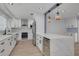 Modern kitchen featuring white cabinets, stainless steel appliances, and marble countertops at 1624 Chateau Dr, Clearwater, FL 33756