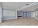 Spacious living room with an electric fireplace, hardwood floors, and custom wall accents at 1624 Chateau Dr, Clearwater, FL 33756