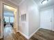 Bright foyer featuring wood-look flooring, leading to the home's interior and bedroom at 18001 Richmond Place Dr # 330, Tampa, FL 33647