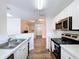 Modern kitchen with white cabinets, stainless steel appliances, and stylish countertops at 18001 Richmond Place Dr # 330, Tampa, FL 33647